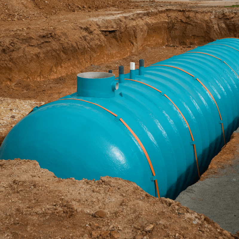 Custom horizontal underground water storage tank with reinforced structural ribs and access manholes for sub-surface installation